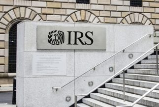 The exterior of an Internal Revenue Service building with IRS signage.