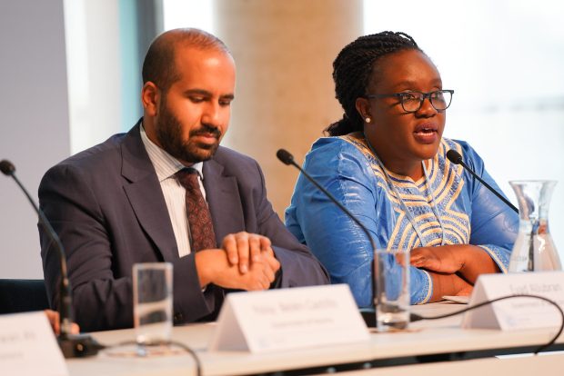 Two UN representatives sit at a table during a Climate Weeks briefing.