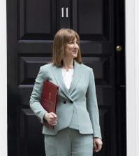 Chancellor Rachel Reeves standing outside 11 Downing Street