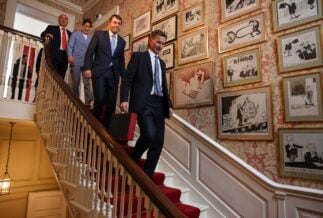 A photograph of UK Chancellor of the Exchequer Jeremy Hunt preparing to leave 11 Downing Street to present his Budget to Parliament.