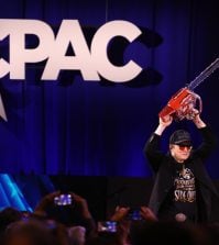Elon Musk wields a chainsaw given to him by Argentina president Javier Milei at the Conservative Political Action Conference. Photo: Gage Skidmore/Flickr