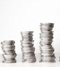 Piles of silver coins acting as stepping stones