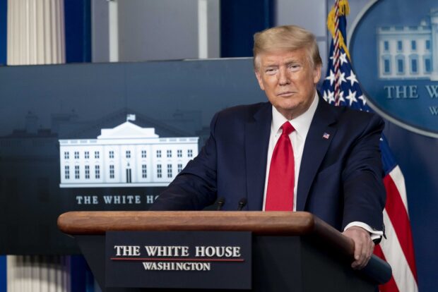 A photograph of Donald trump holding a coronavirus briefing when he was US president