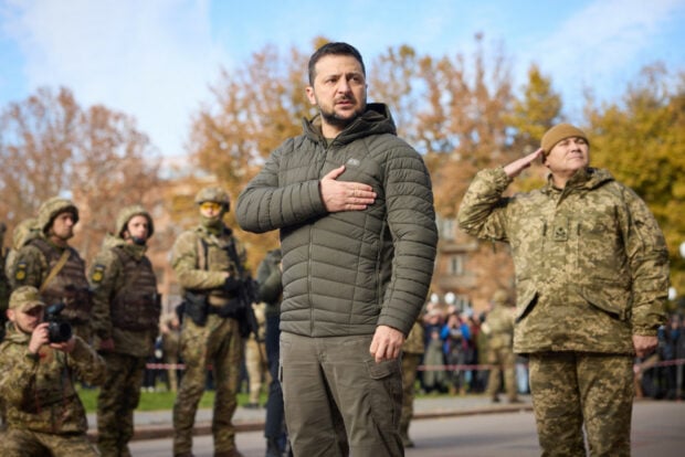 Ukrainian president Volodymyr Zelensky takes part in hoisting the State Flag of Ukraine in liberated Kherson in November 2022.