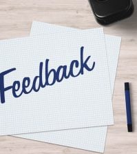 A image of a piece of pape ron a desk with the word feedback on it