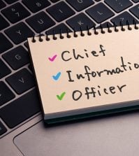 The letters CIO on a post it note.