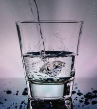 Water being poured into a glass.